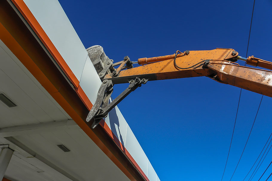 Excavator Ready To Push Fuel Canopy Over. Image by W.C. Black and Sons, Inc.