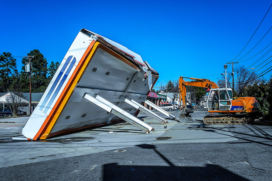 Fuel Station Canopy Knocked Down With HALLA Excavator. Image by W.C. Black and Sons, Inc.