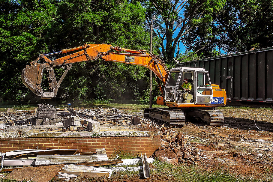 HALLA Excavator moving concrete blocks at demoltion site in Charlotte, NC. Image by W.C. Black and Sons, Inc.