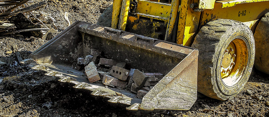 Demolition Debris Removal with a GEHL SkidSteer on a Demolition Project in Charlotte, NC. Image by W.C. Black and Sons, Inc.