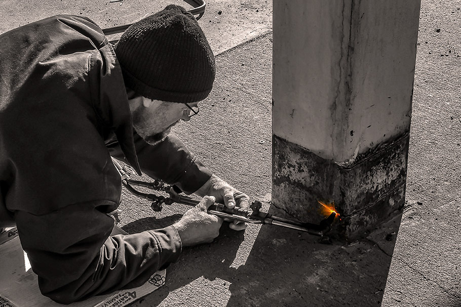 Cutting Support Beams to Fuel Station Canopy with Torch. Image by W.C. Black and Sons, Inc.